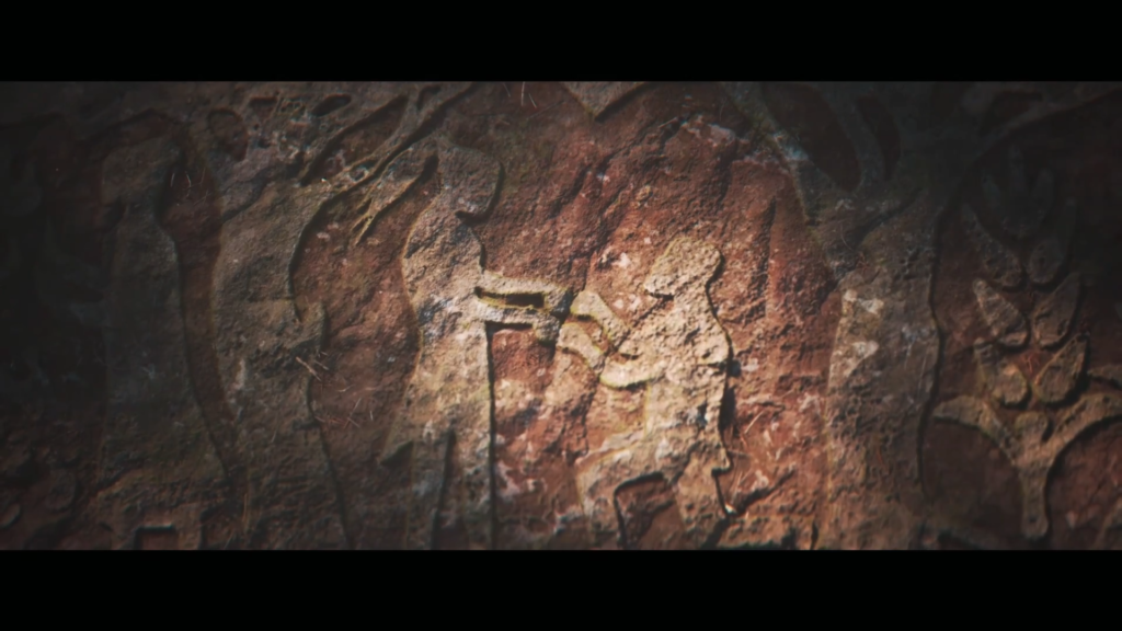 Ancient rock carving shows figure holding animal on wall