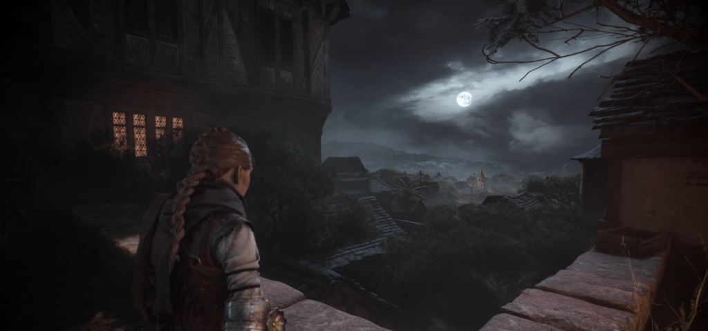 Woman watches moonlit village from stone balcony at night