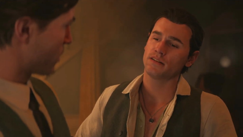 Two men talking indoors under warm lighting