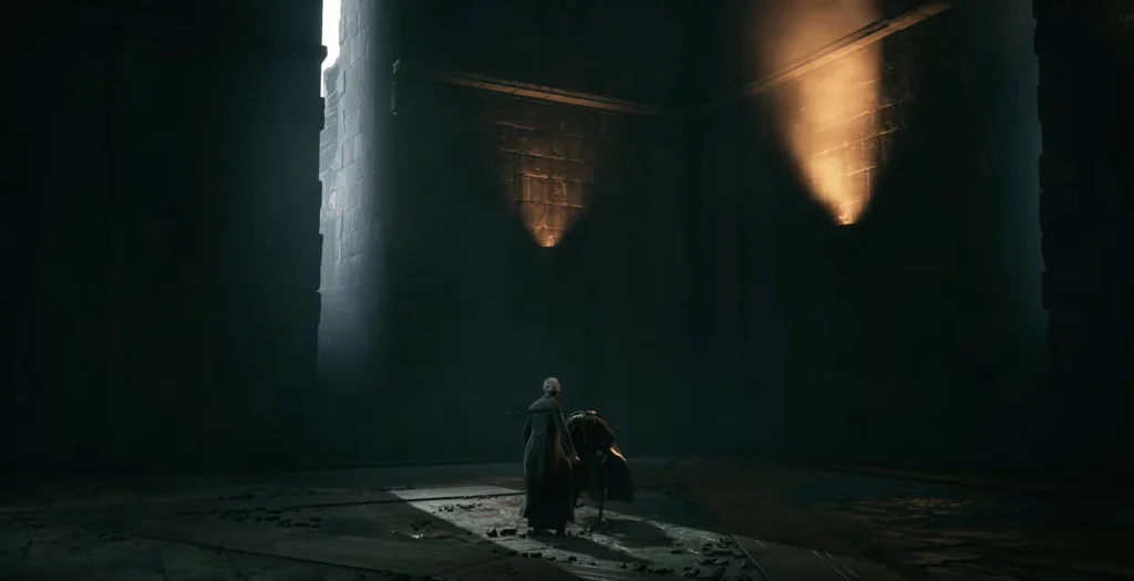 Two cloaked figures stand in dark stone hall