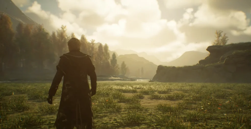 Cloaked figure walks across grassy valley at sunset