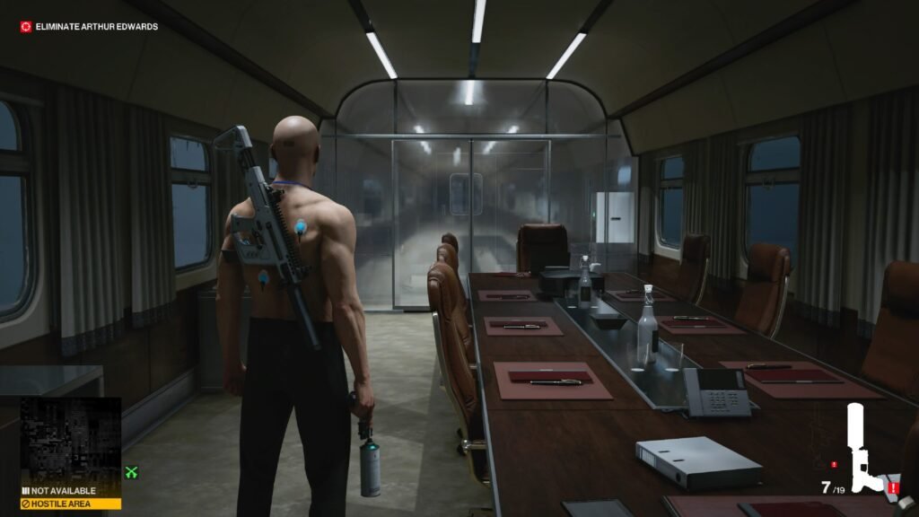 Agent 47 stands in train conference car, Hitman