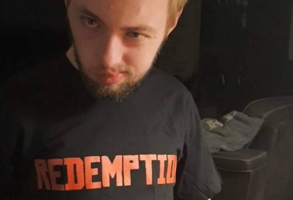 Man wearing black "REDEMPTION" t-shirt.