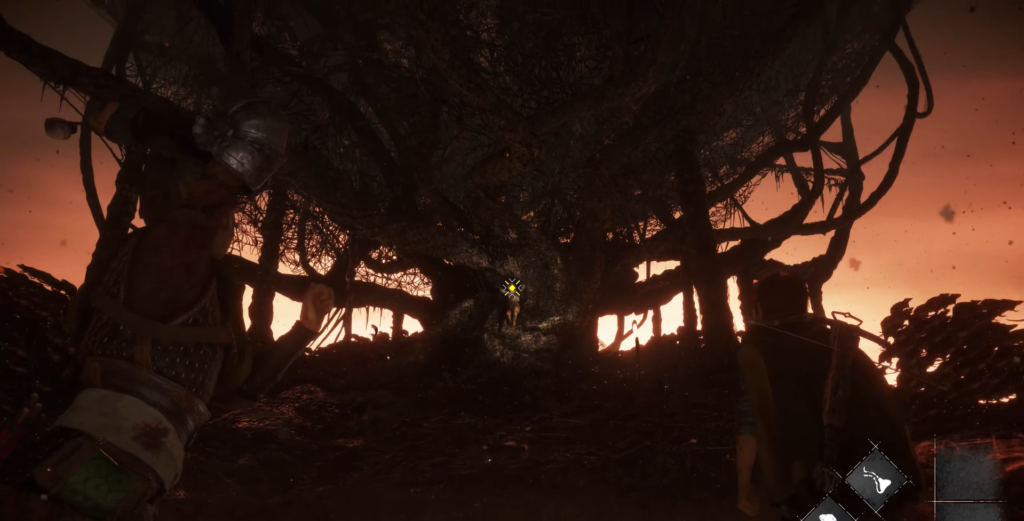 Dark tree silhouette against orange sky.