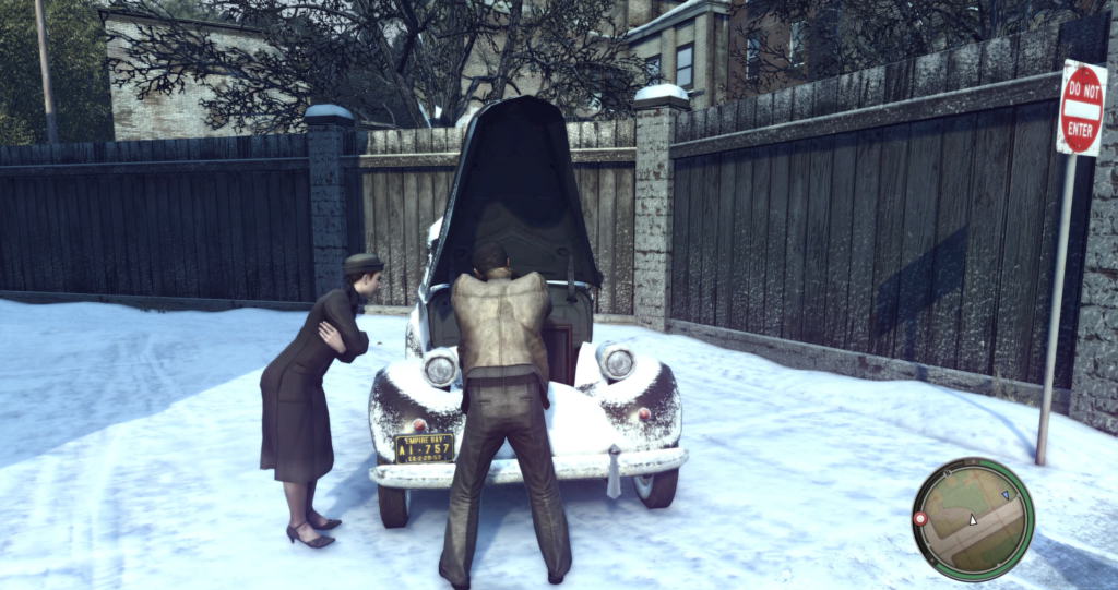 Man inspecting car engine, woman watching.