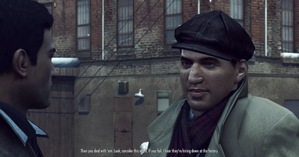 Man in cap speaks to another.