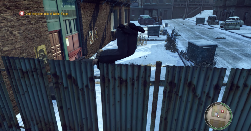 Man in black jumps over fence.