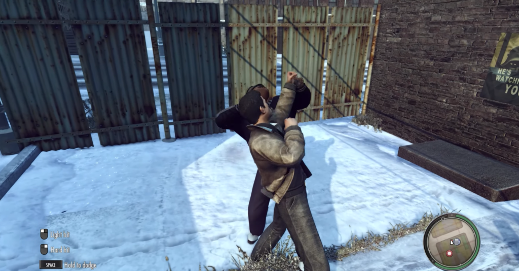 man wrestling another man in snow