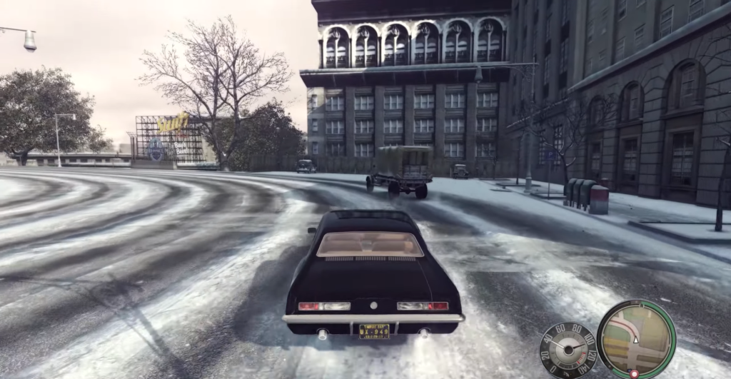 black car driving snowy street