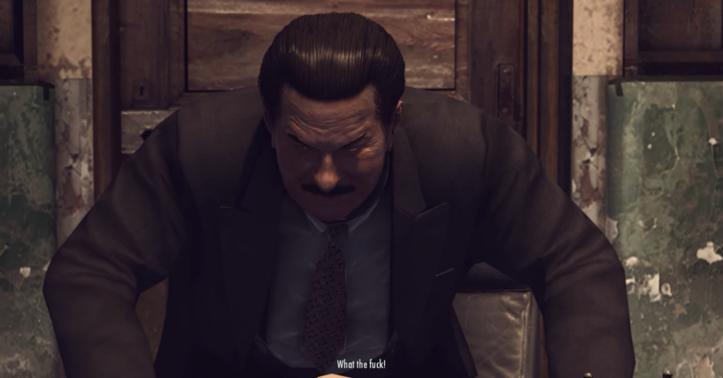 Man in suit, angry expression, shouting.