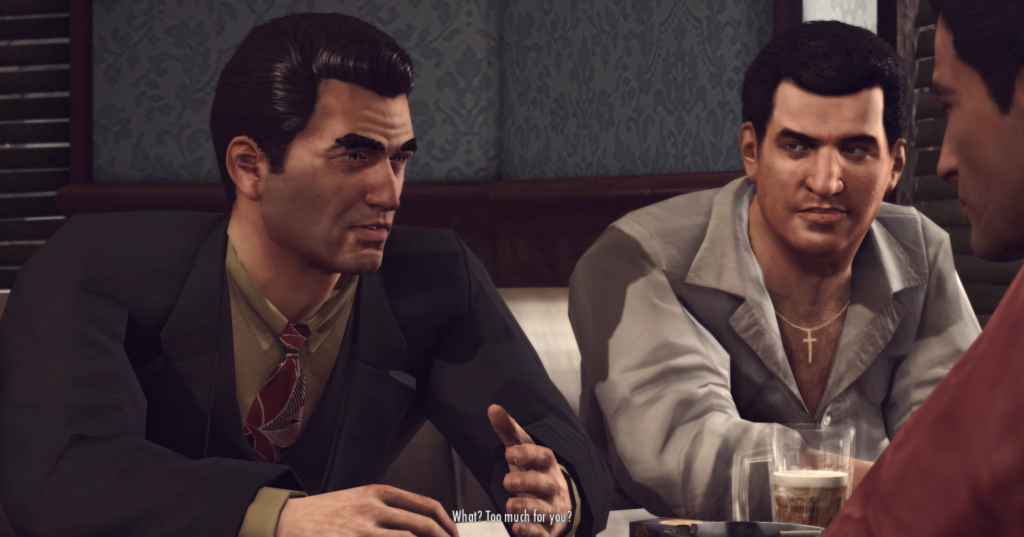 Two men conversing in a restaurant.