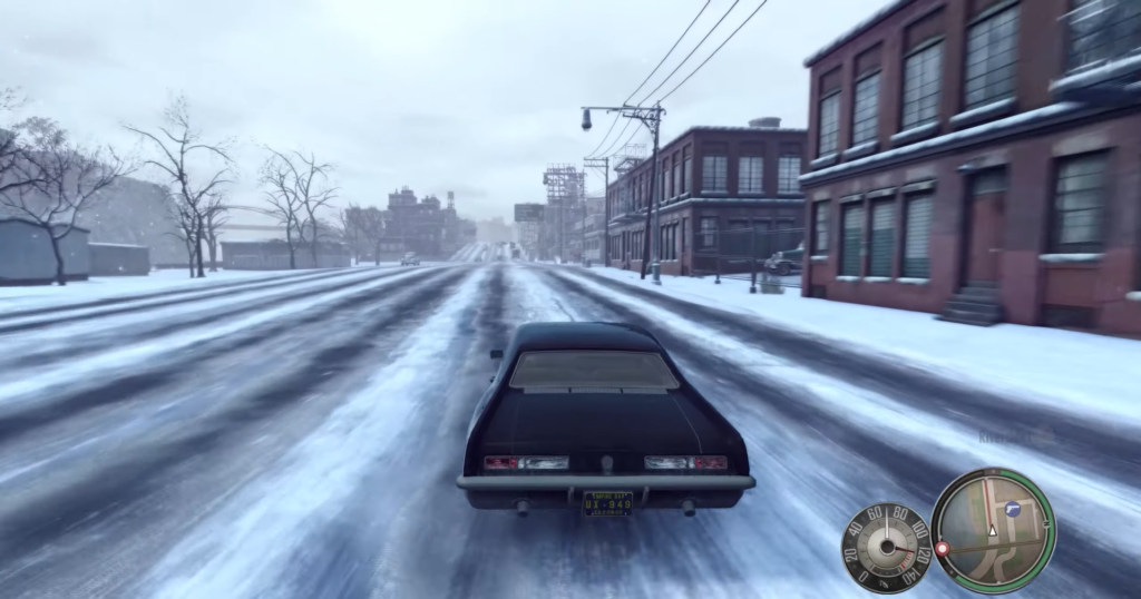 black car driving snowy street