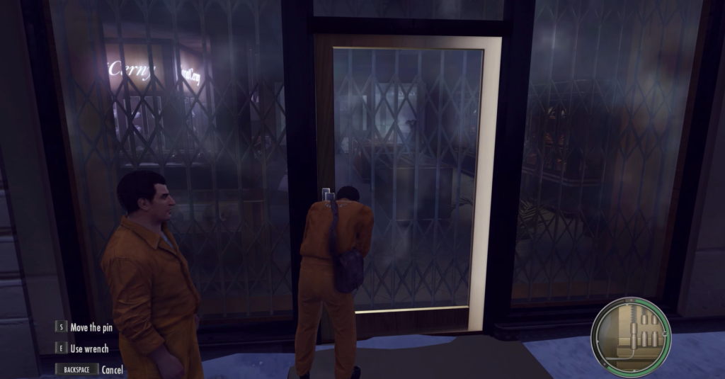 Two men in orange jumpsuits breaking door.