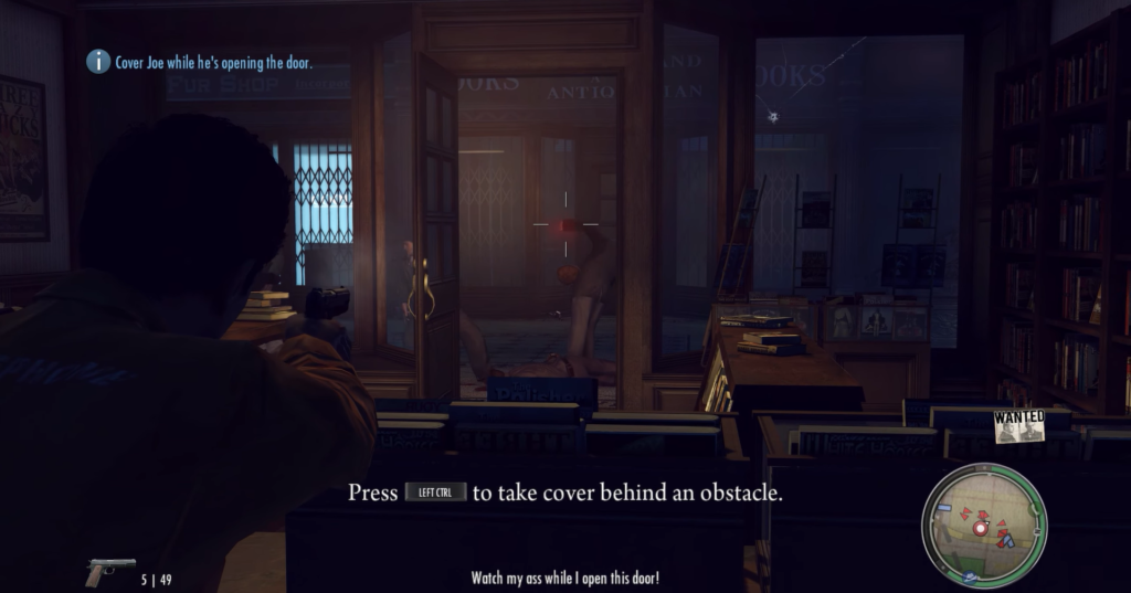 Man aiming gun inside bookstore doorway.