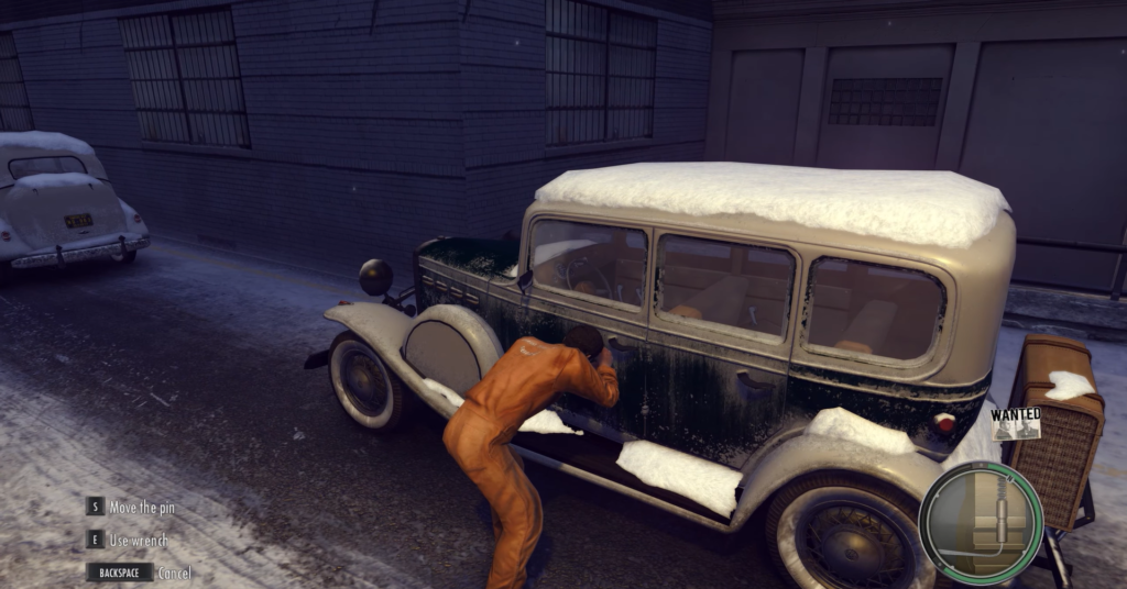 Man in orange jumpsuit stealing car.