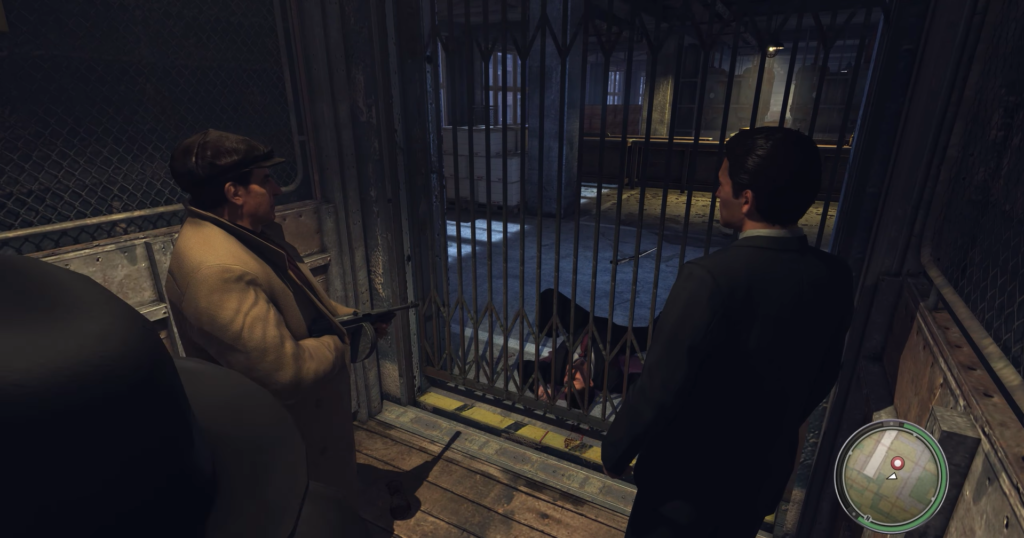 Two men with guns near gate.