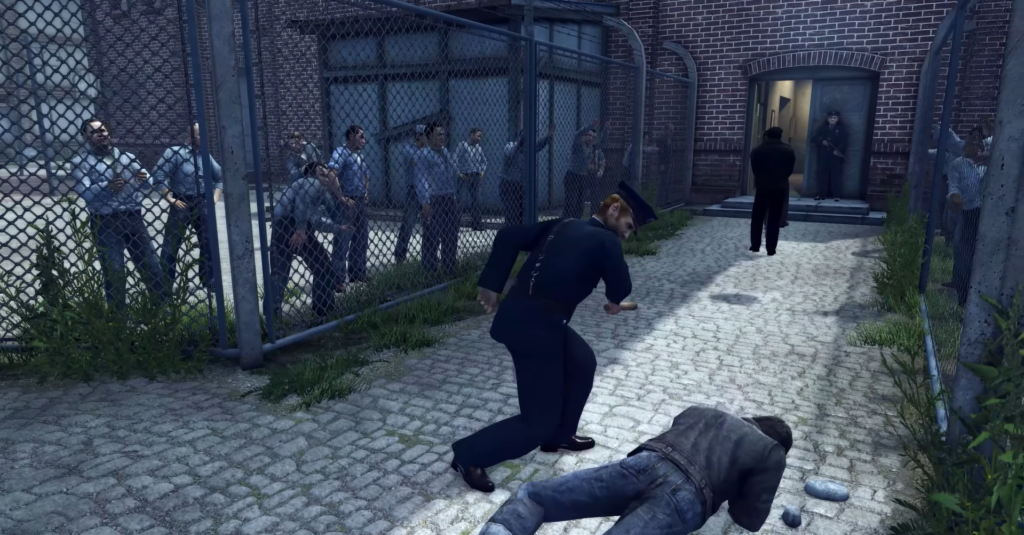 Police officer striking man on ground.