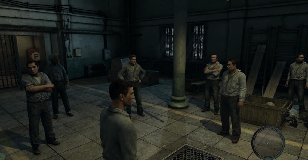 men in gray uniforms discussing indoors