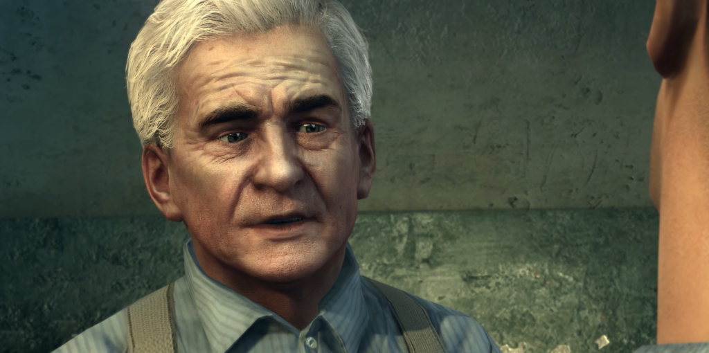 Elderly man with gray hair speaking.