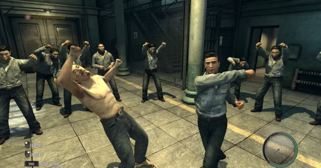 Men fighting in prison setting.