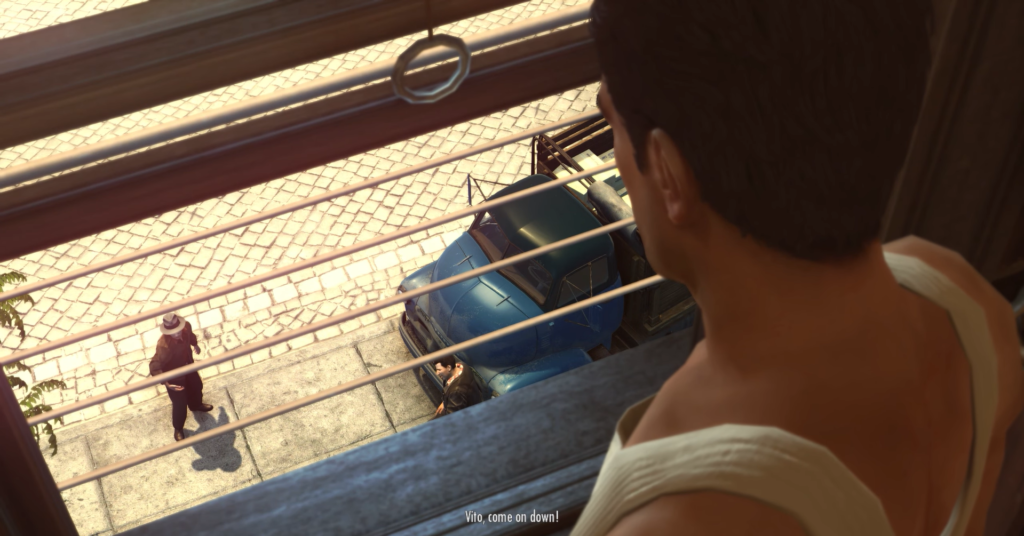 Man looking down at street scene.