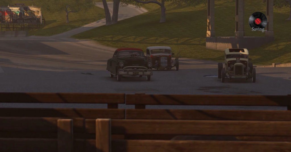 Classic cars parked on street corner.