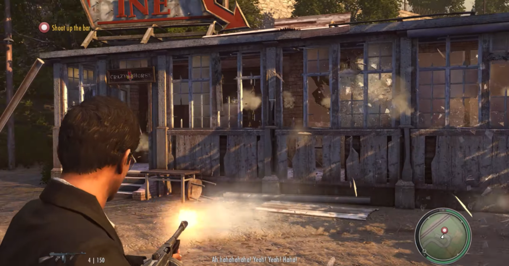 Man shooting at damaged building exterior.