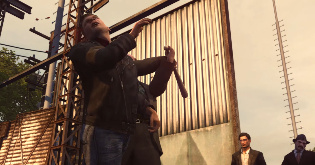 Man holding bat, distressed expression outdoors.