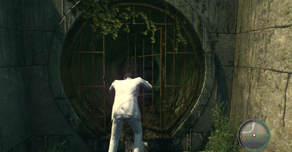 Man in white suit entering sewer.