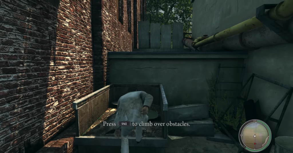 Man climbing over obstacles in alley.