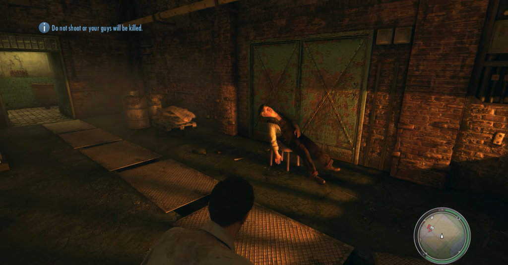 Man slumped on chair in warehouse.