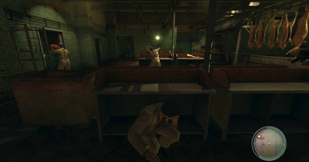 Man hiding behind wooden counter in warehouse.