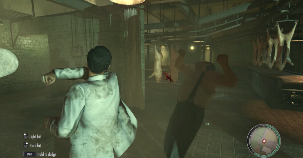 Man in white suit fighting in butcher shop.