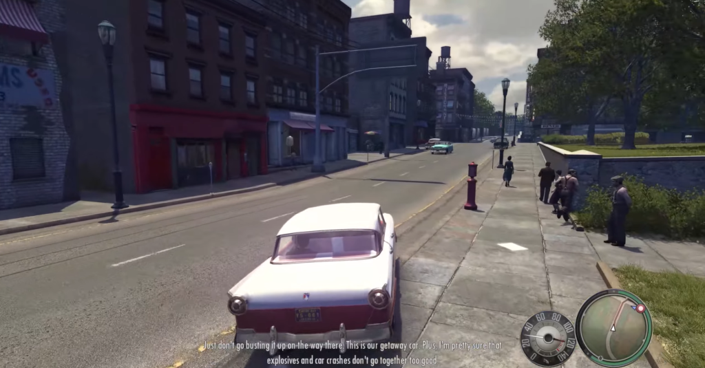 Classic white car parked on street.