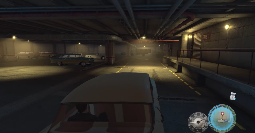 Dimly lit parking garage with vintage cars.