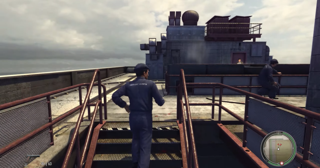 Man in blue jumpsuit climbing stairs.