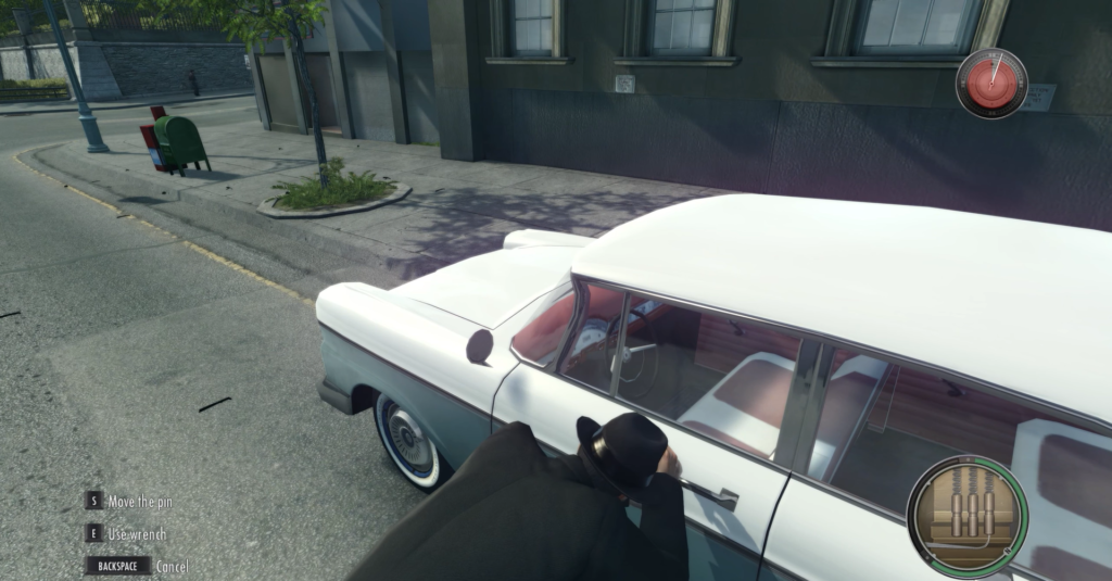 Man in suit leaning on white car.