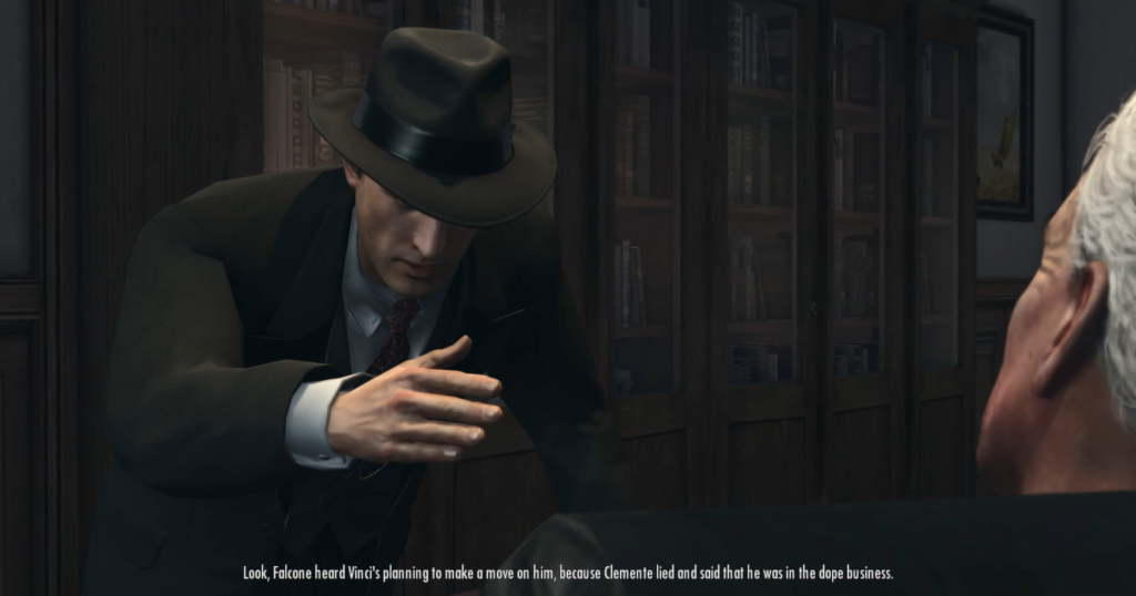 Man in fedora gestures, discussing business.