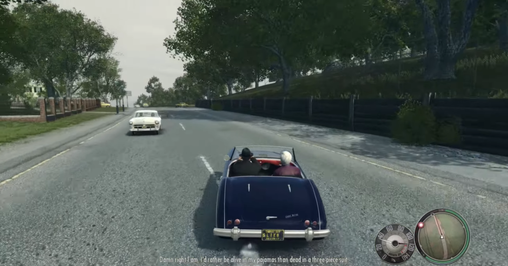 Convertible car driving on road.