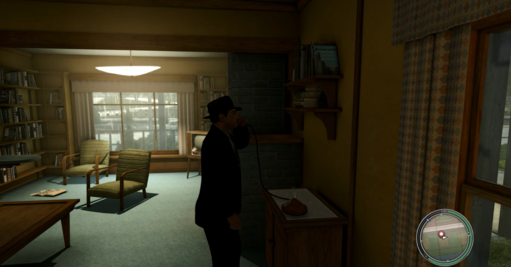 Man in suit using rotary phone.