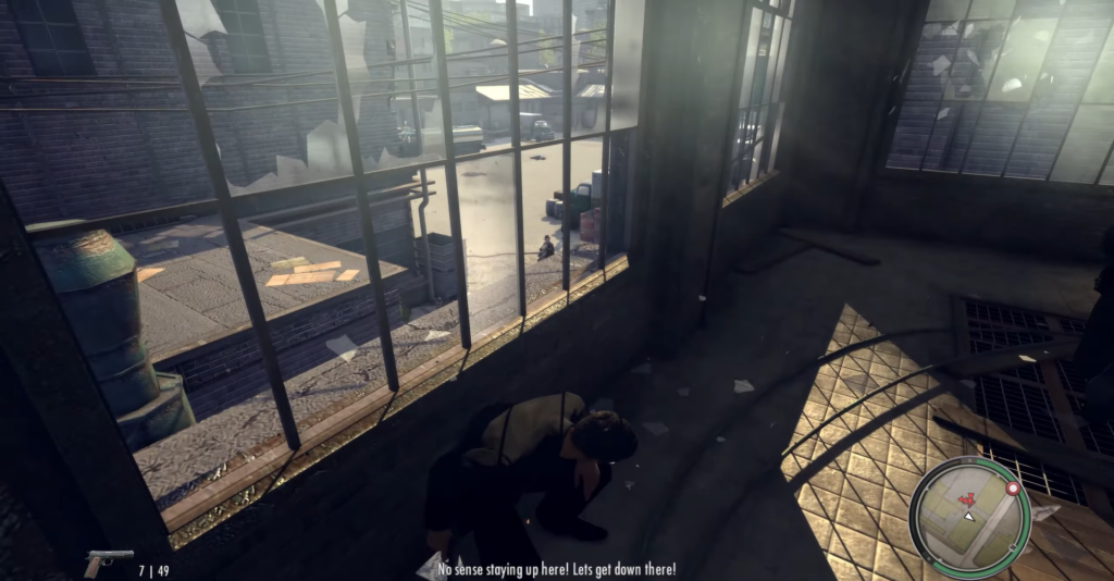 Man crouching near window, urban scene.