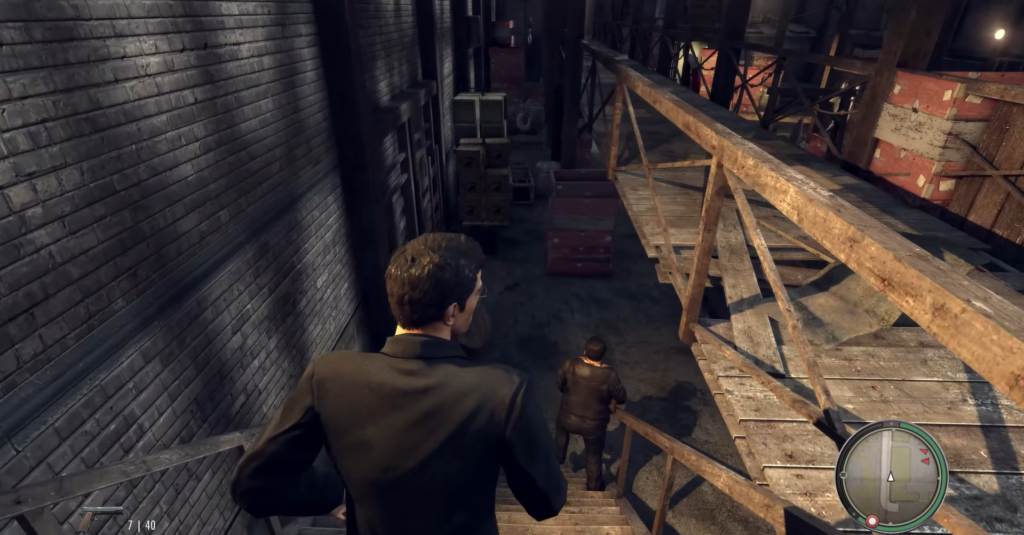 man in suit overlooking warehouse scene