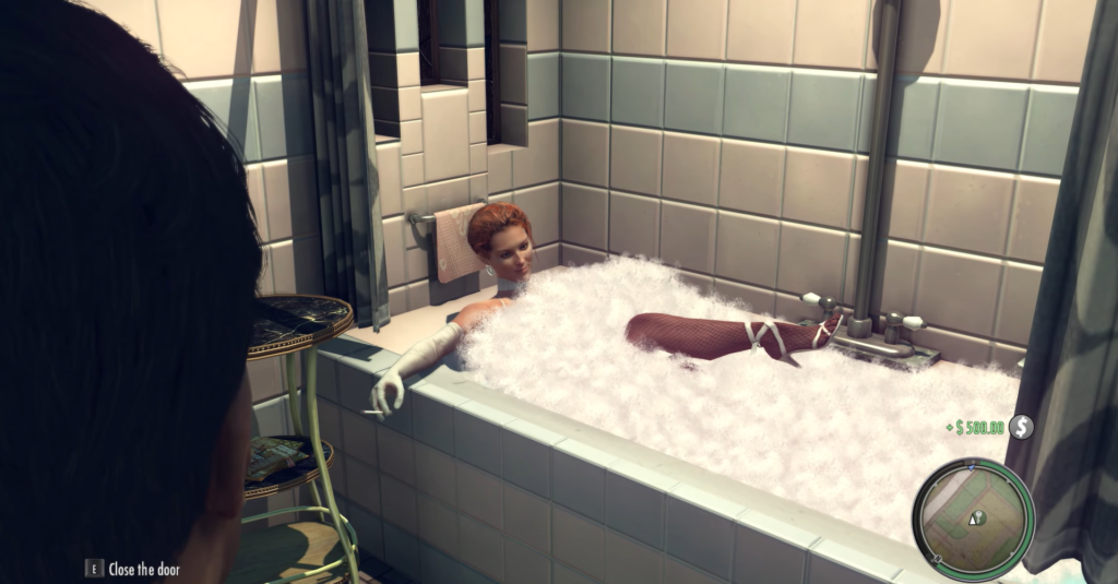 Woman relaxing in bathtub filled with bubbles.