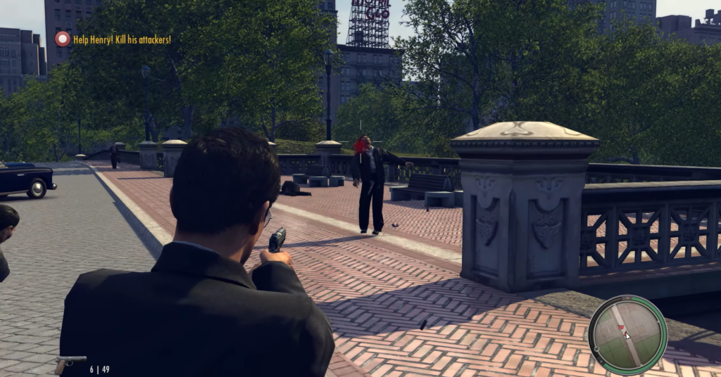 Man in suit aims gun outdoors.