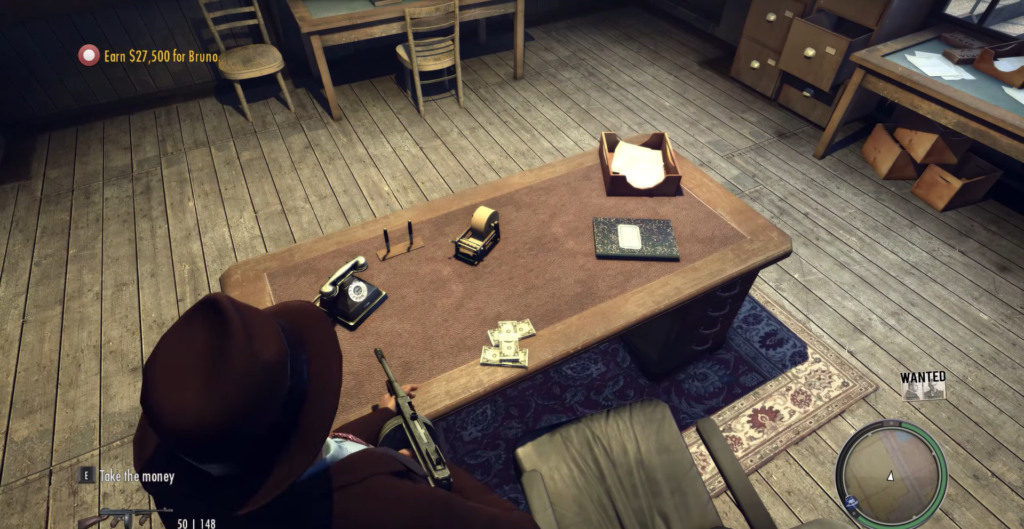 Desk with money, phone, and documents.