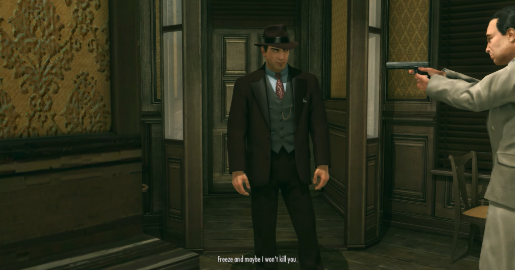 Man in suit faces gunman threateningly.