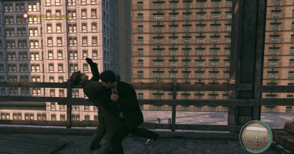 Two men fighting on rooftop edge.