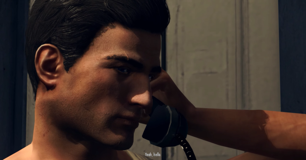 Man speaking on black telephone receiver.