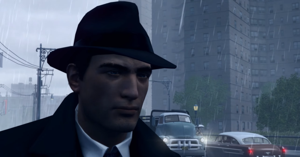 Man in black hat, rain falling.