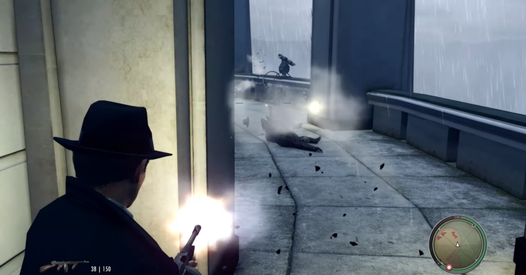 Man shooting gun near fallen body.